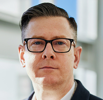 Alexander Hughes, CEO kryptomenovej obchodnej spoločnosti, portrét.